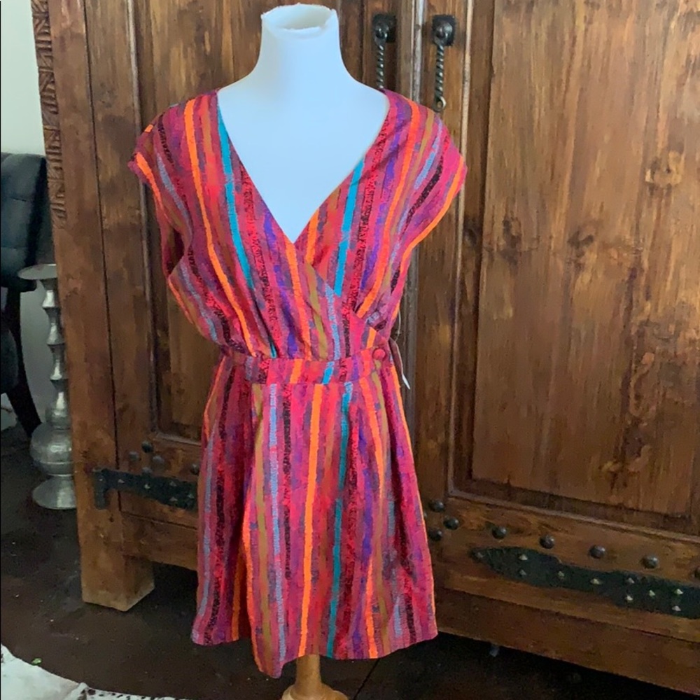 NWT multi colored romper. Flattering